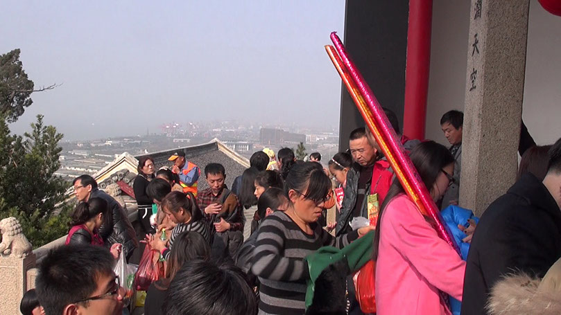 Burning king-size joss sticks and incense. Buddhistic ritual on day three of chinese new year. Guangjiao Temple on Langshan Hill, Nantong, Jiang